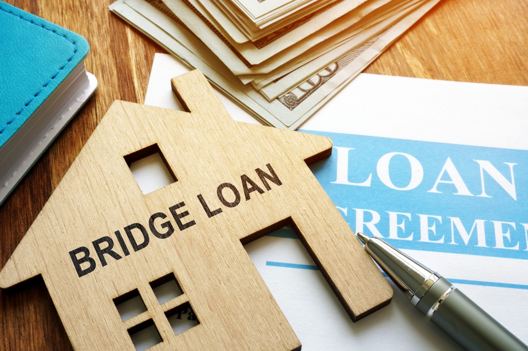 Bridge loan and mortgage agreement with pen. – Calculator